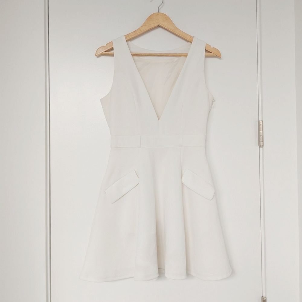 White deep V mini dress with pockets from Japan